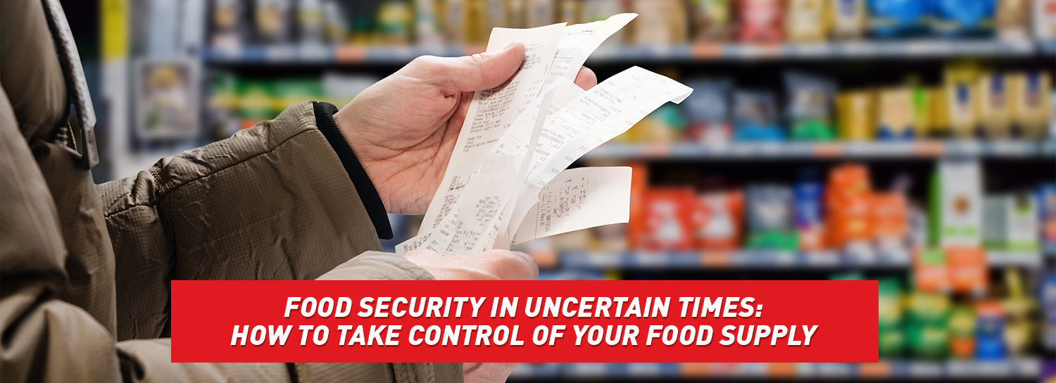 A person holding a long receipt in a grocery store.