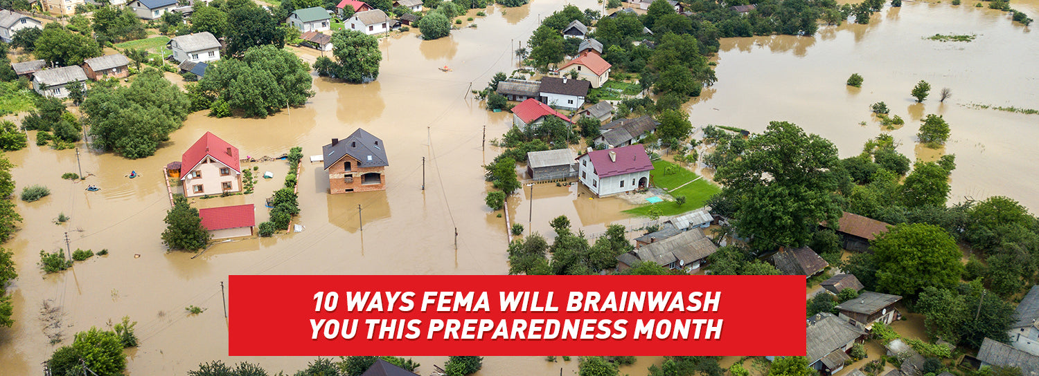 An aerial view of a suburban neighborhood, flooded with muddy water.