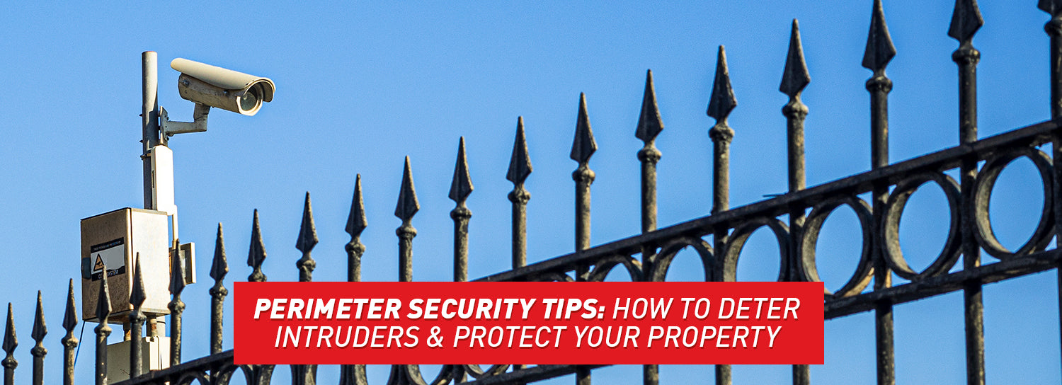 A tall spiked fence with an even taller security camera hovering over it.