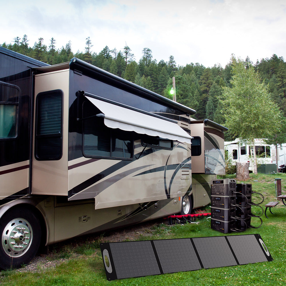 Grid Doctor "power tower" (one 2200 battery and 2200XP batteries connected) and solar panel being used to power an RV. 