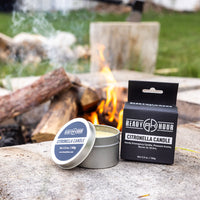 Thumbnail for citronella candle by ready hour and packaging sitting next to a campfire