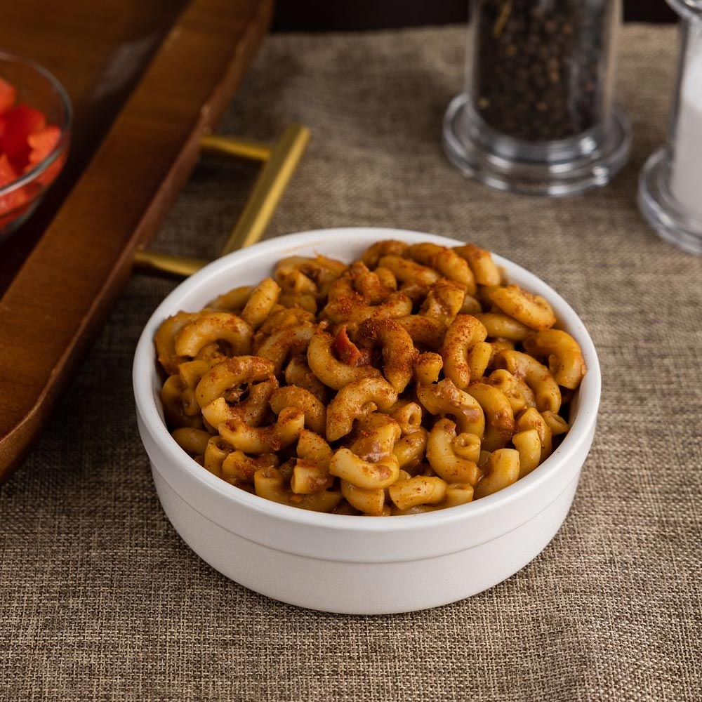 Chili mac with pasta in a white bowl