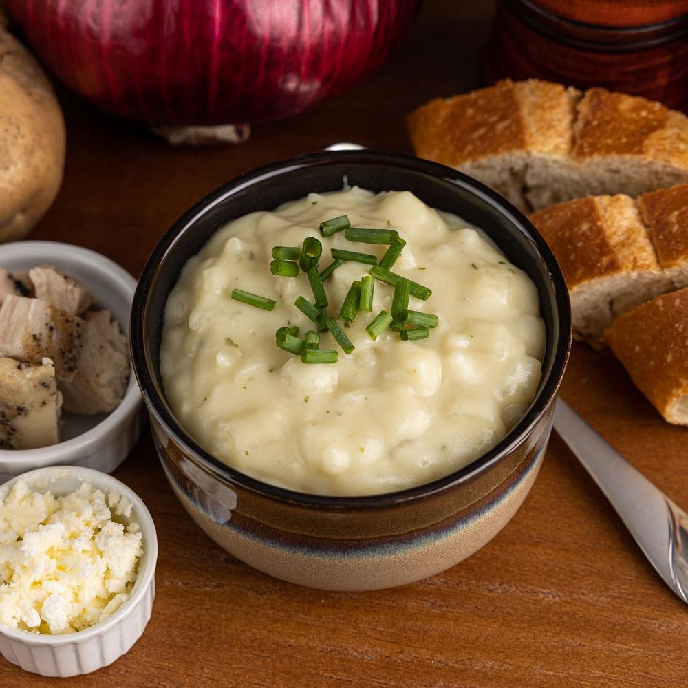 Homestyle mashed potatoes topped with a green onion garnish