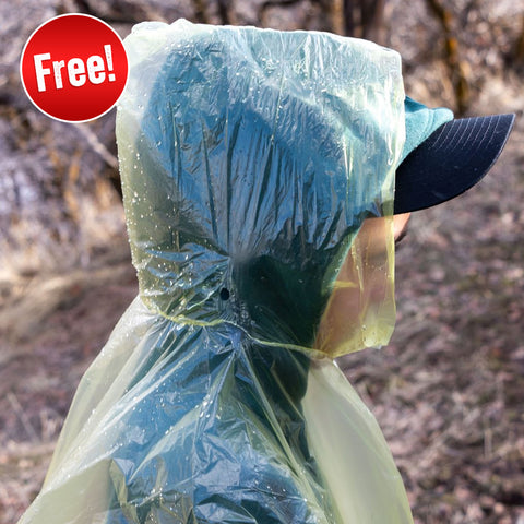 Image of Man wearing emergency poncho included in Independence Day Bundle