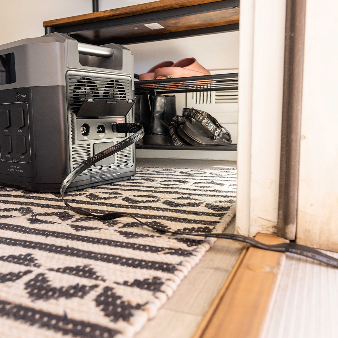 Extension cord passing through a doorway for the 2200 & 3300 Solar Generators by Grid Doctor