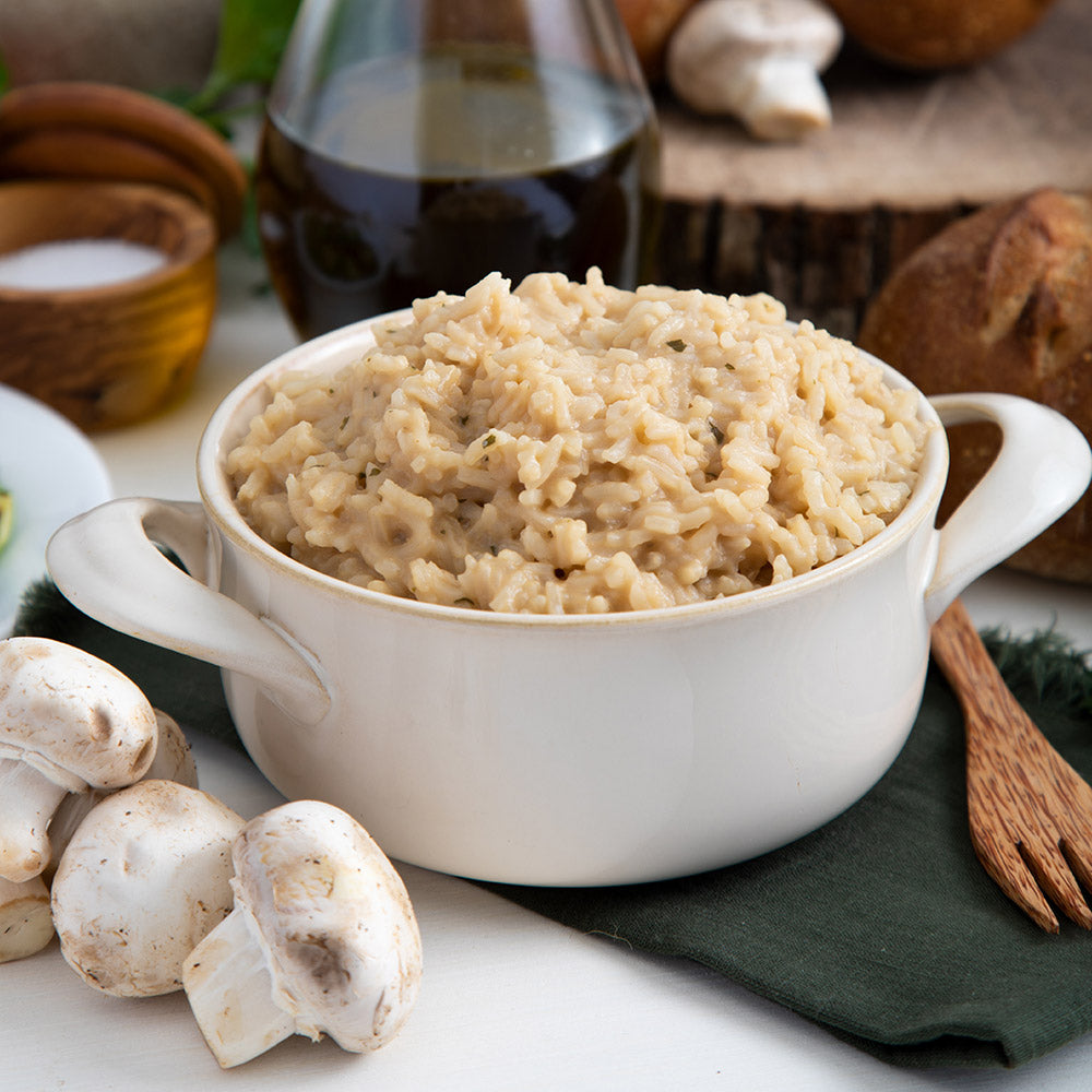 White bowl of creamy mushroom rice pilaf