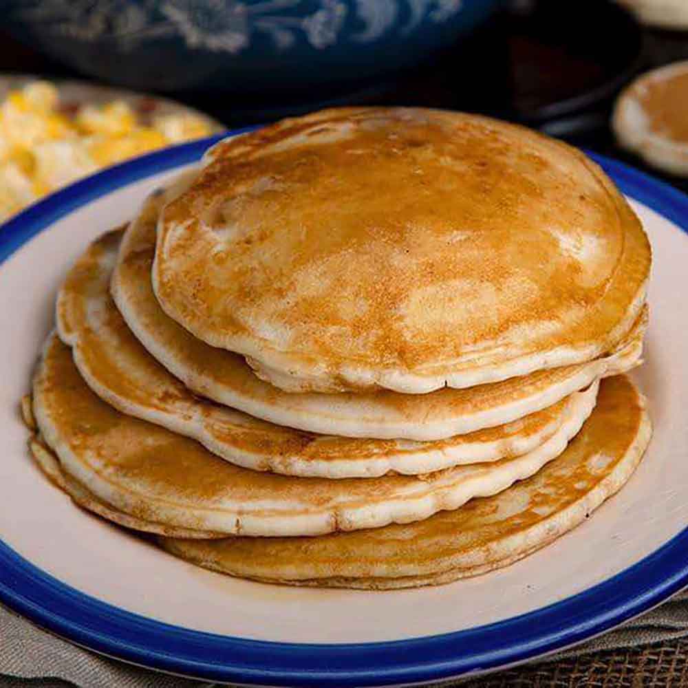 Stack of fluffy pancakes on a plate