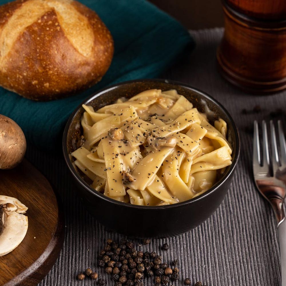 Bowl of creamy stroganoff with pepper on top