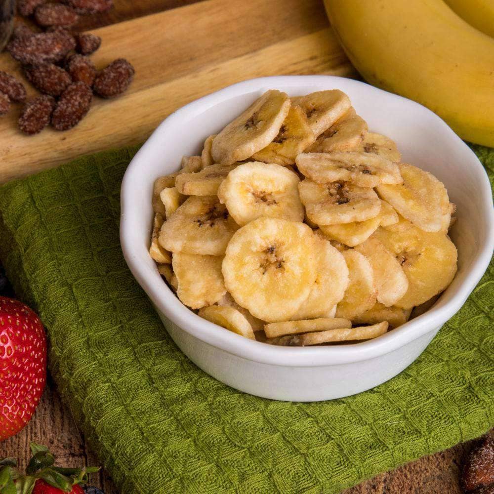 Crispy banana chips in a white bowl